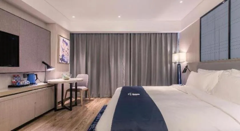 Bed in Echarm Hotel Wuhan Gaotie Jianshe 2nd Road Metro Exit