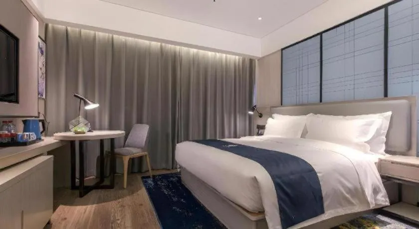 Bed in Echarm Hotel Wuhan Gaotie Jianshe 2nd Road Metro Exit