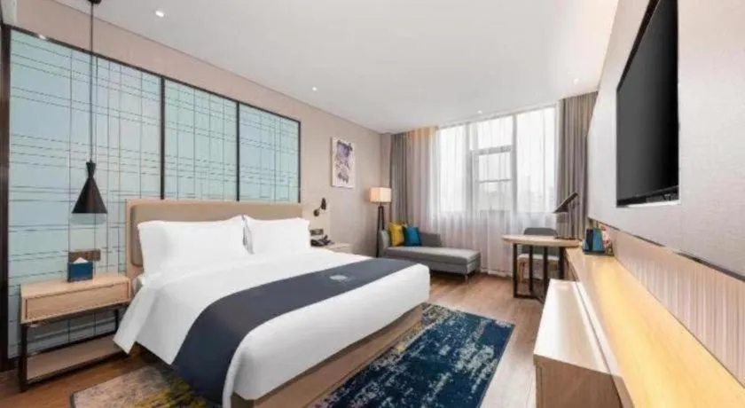 Bed in Echarm Hotel Wuhan Gaotie Jianshe 2nd Road Metro Exit