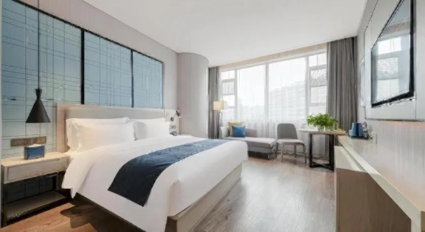 Bed in Echarm Hotel Wuhan Gaotie Jianshe 2nd Road Metro Exit