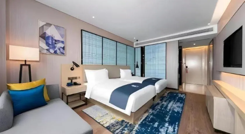 Bed in Echarm Hotel Wuhan Gaotie Jianshe 2nd Road Metro Exit