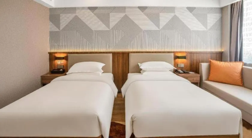 Bed in Borrman Hotel Zoucheng Huamaowan Mall