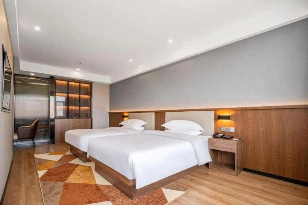 Bed in Borrman Hotel Zoucheng Huamaowan Mall