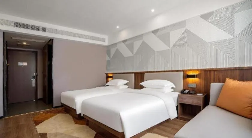 Bed in Borrman Hotel Zoucheng Huamaowan Mall