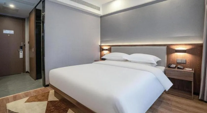 Bed in Borrman Hotel Zoucheng Huamaowan Mall