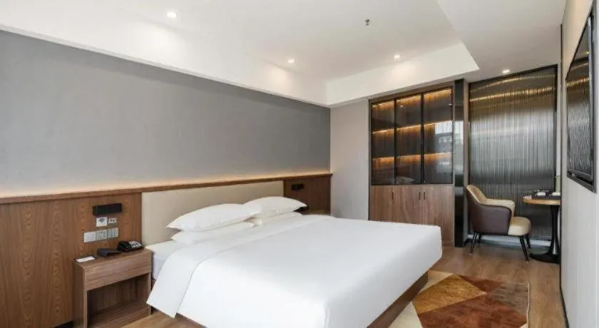 Bed in Borrman Hotel Zoucheng Huamaowan Mall