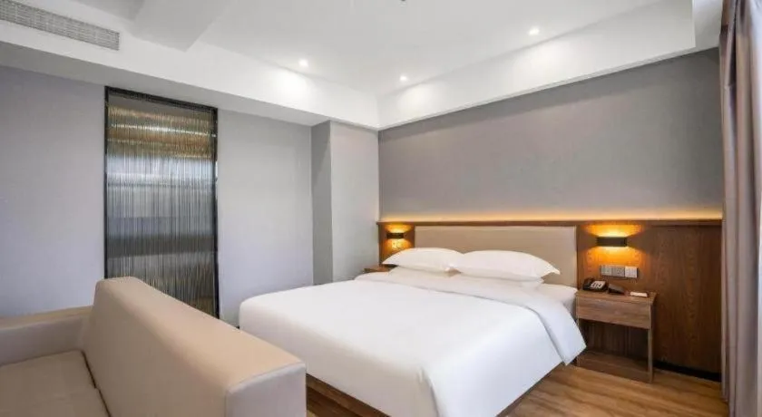 Bed in Borrman Hotel Zoucheng Huamaowan Mall