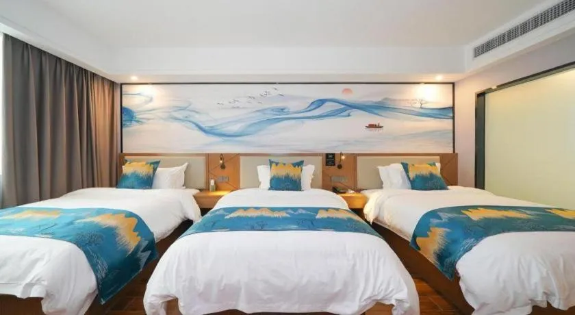 Bed in Borrman Hotel Nanning Anji Passenger Station Xijin Metro Station