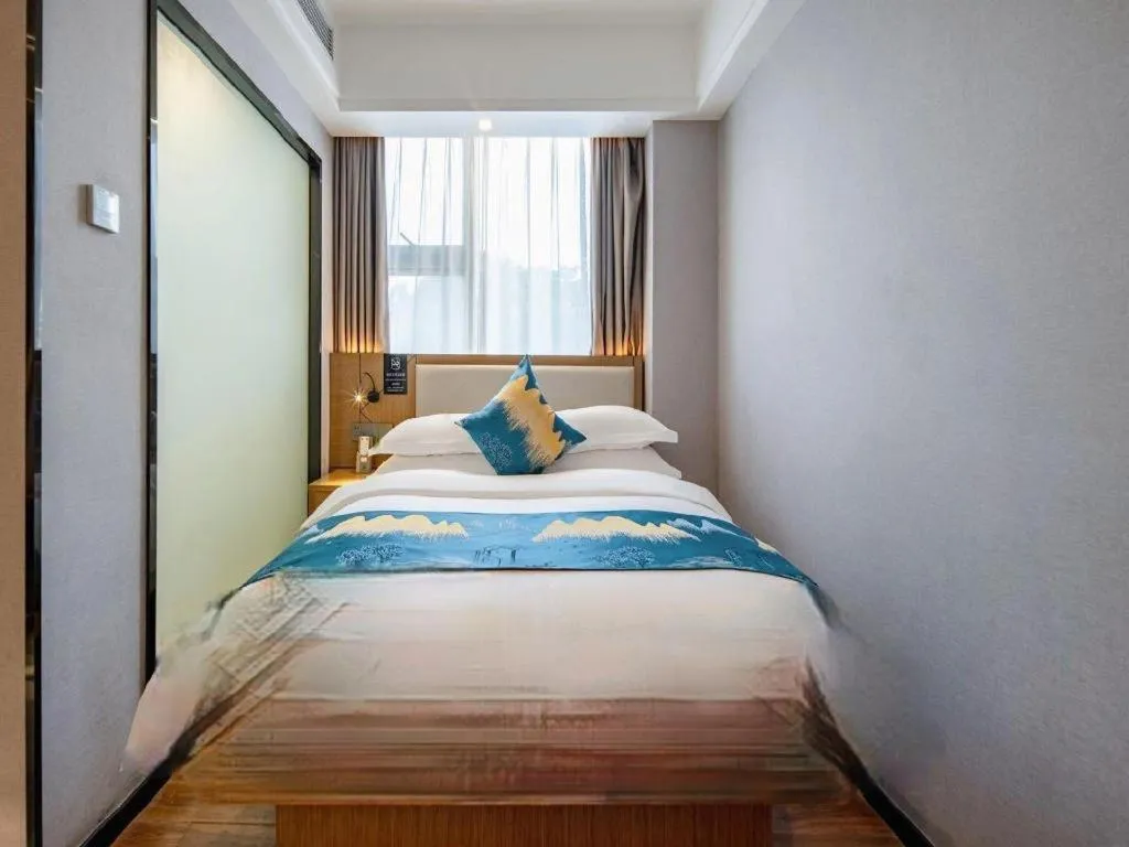 Bed in Borrman Hotel Nanning Anji Passenger Station Xijin Metro Station