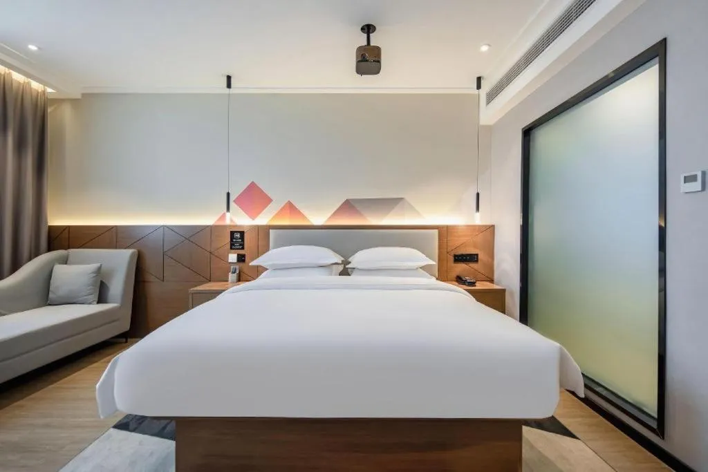 Bed in Borrman Hotel Nanning Anji Passenger Station Xijin Metro Station