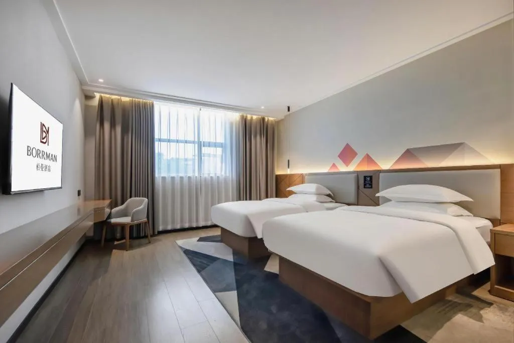 Bed in Borrman Hotel Nanning Anji Passenger Station Xijin Metro Station