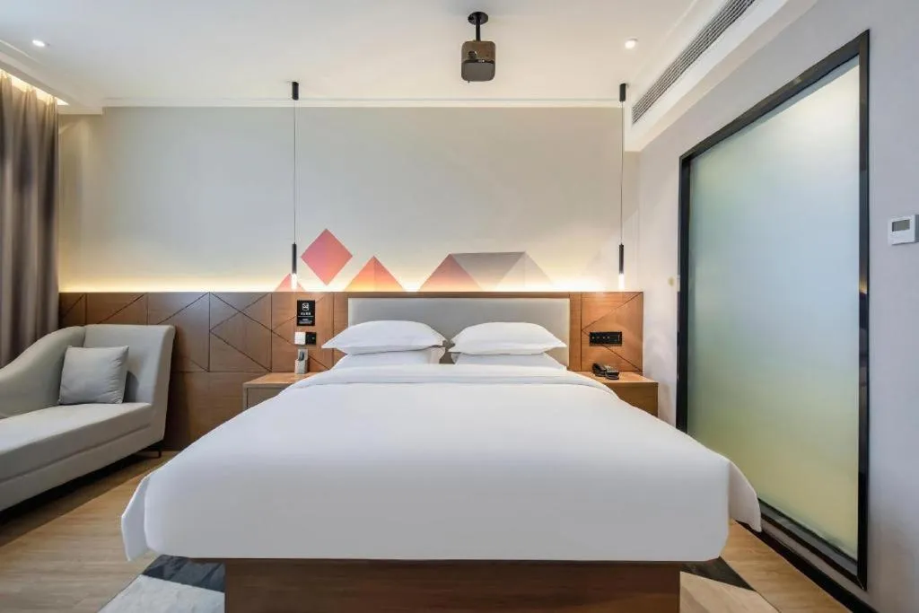 Bed in Borrman Hotel Nanning Anji Passenger Station Xijin Metro Station