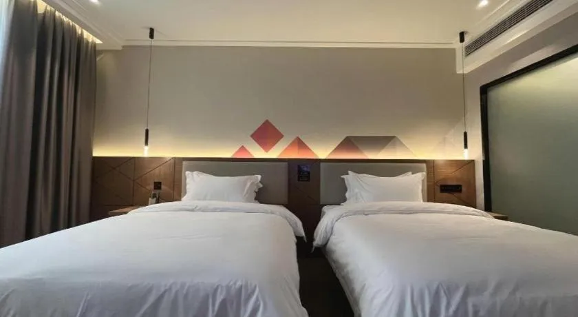 Bed in Borrman Hotel Nanning Anji Passenger Station Xijin Metro Station