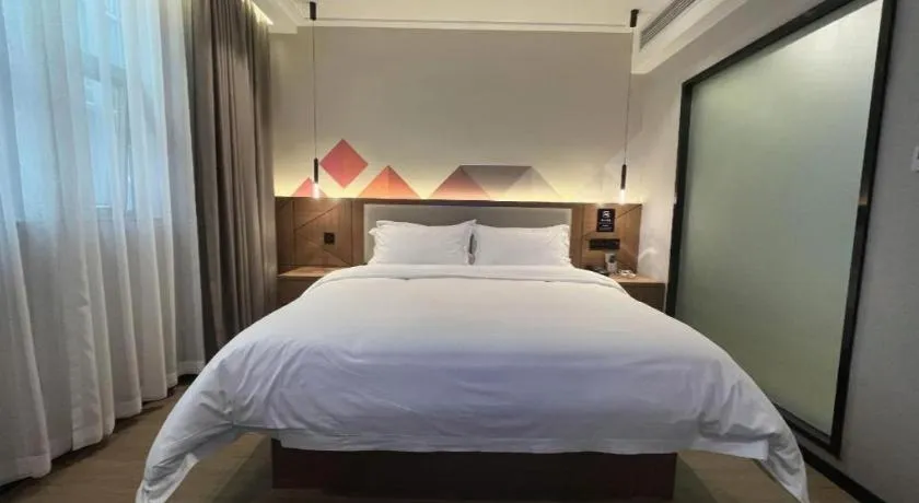 Bed in Borrman Hotel Nanning Anji Passenger Station Xijin Metro Station
