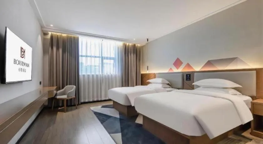 Bed in Borrman Hotel Nanning Anji Passenger Station Xijin Metro Station