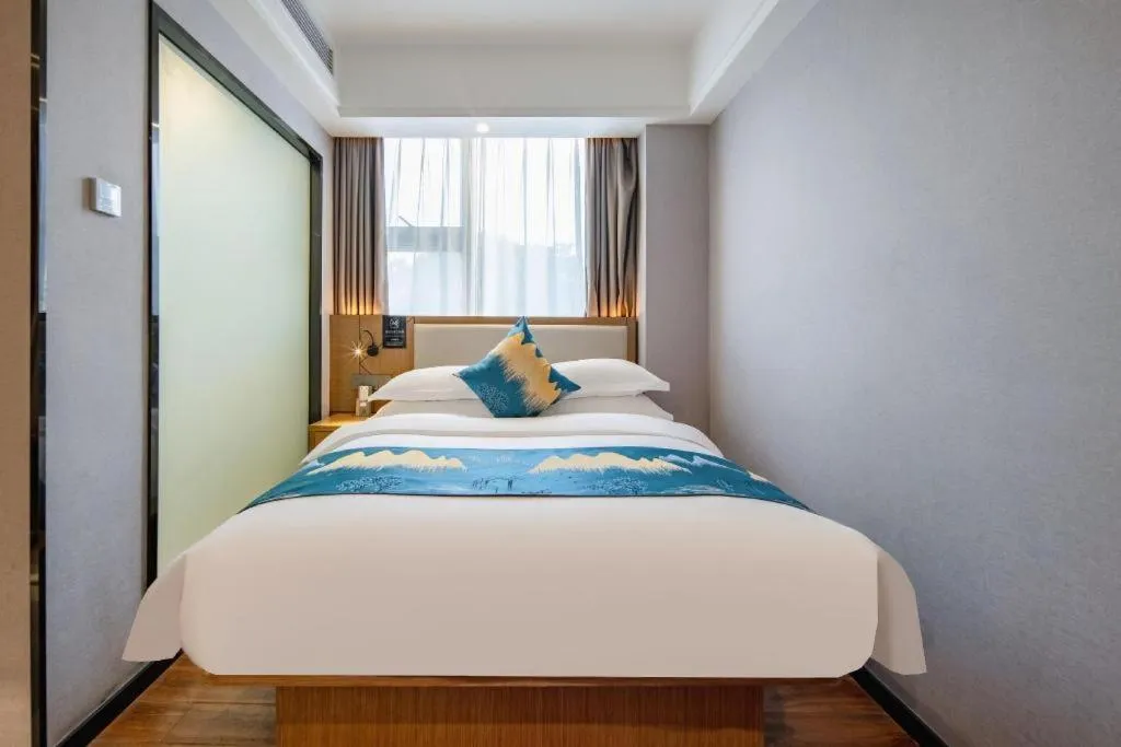 Bed in Borrman Hotel Nanning Anji Passenger Station Xijin Metro Station