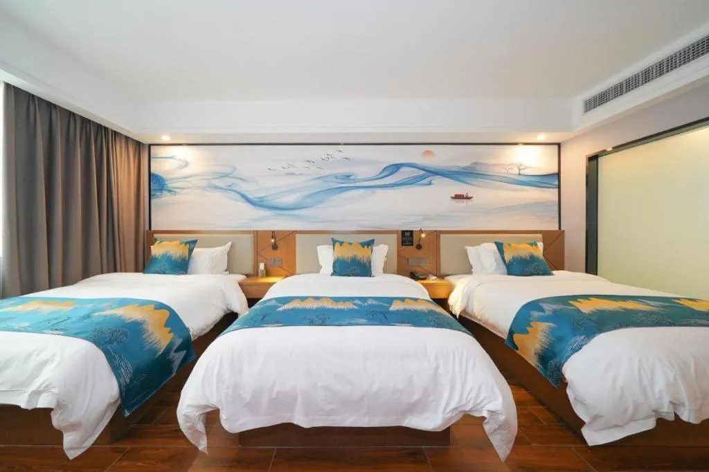 Bed in Borrman Hotel Nanning Anji Passenger Station Xijin Metro Station