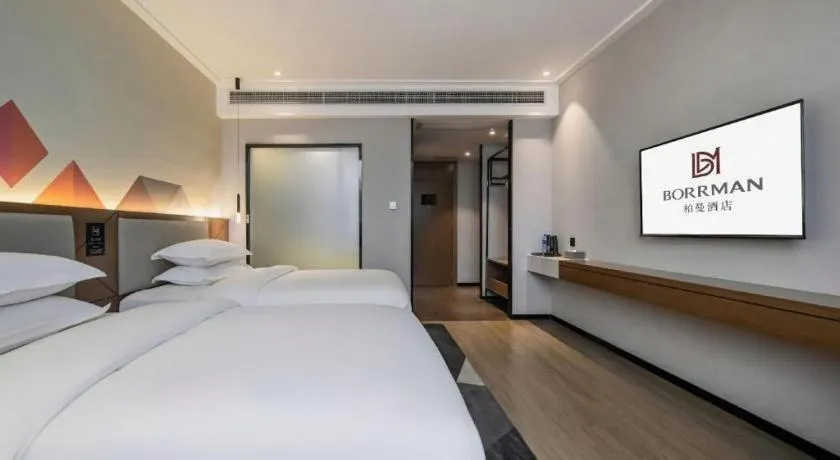 Bed in Borrman Hotel Nanning Anji Passenger Station Xijin Metro Station