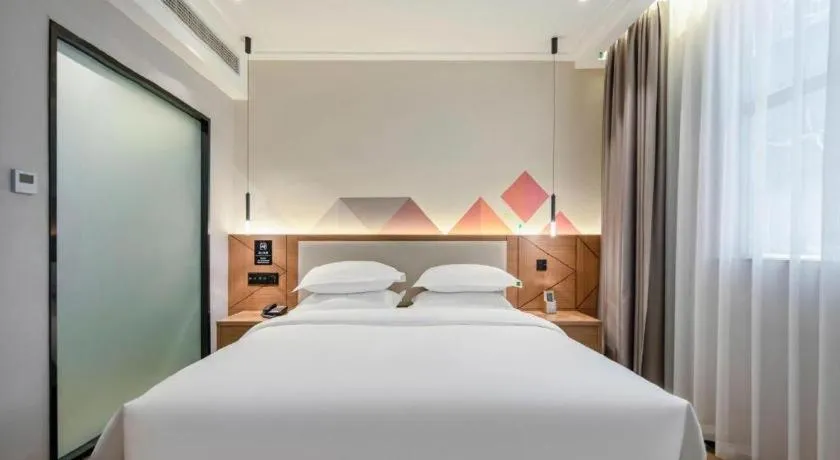 Bed in Borrman Hotel Nanning Anji Passenger Station Xijin Metro Station