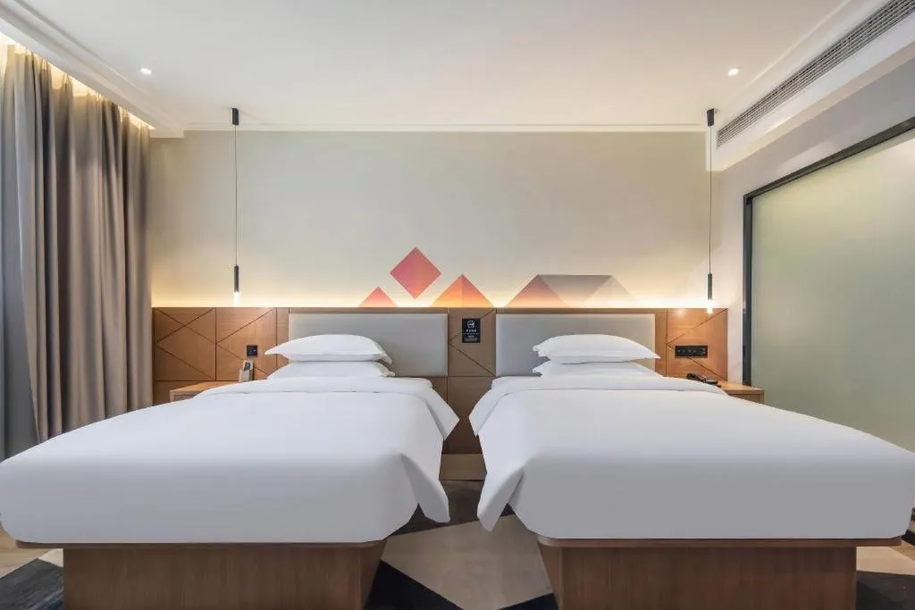 Bed in Borrman Hotel Nanning Anji Passenger Station Xijin Metro Station