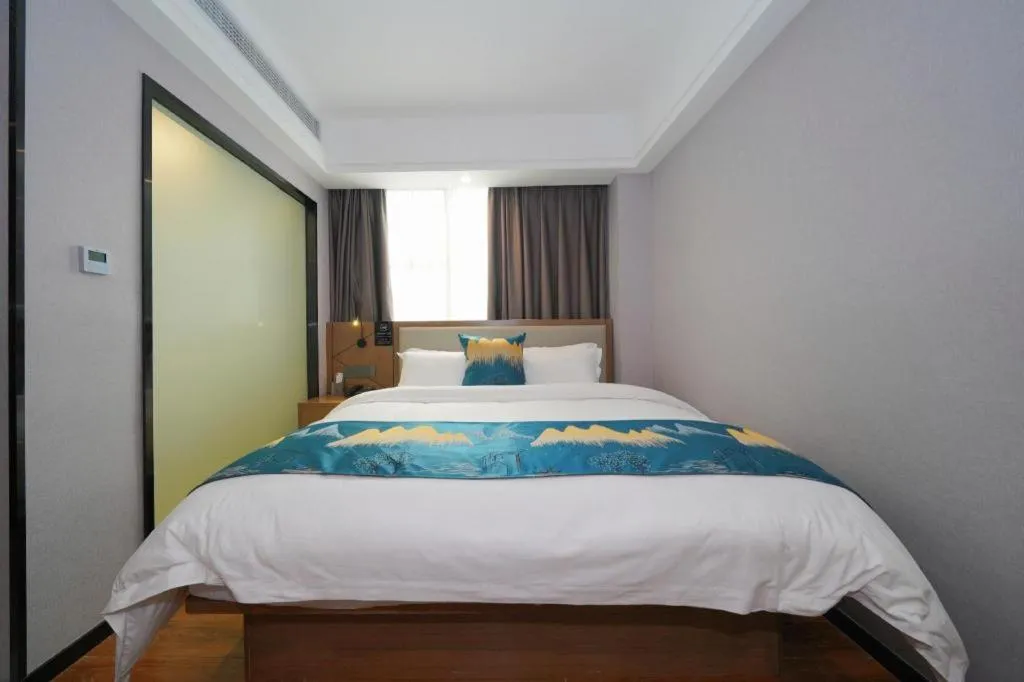 Bed in Borrman Hotel Nanning Anji Passenger Station Xijin Metro Station