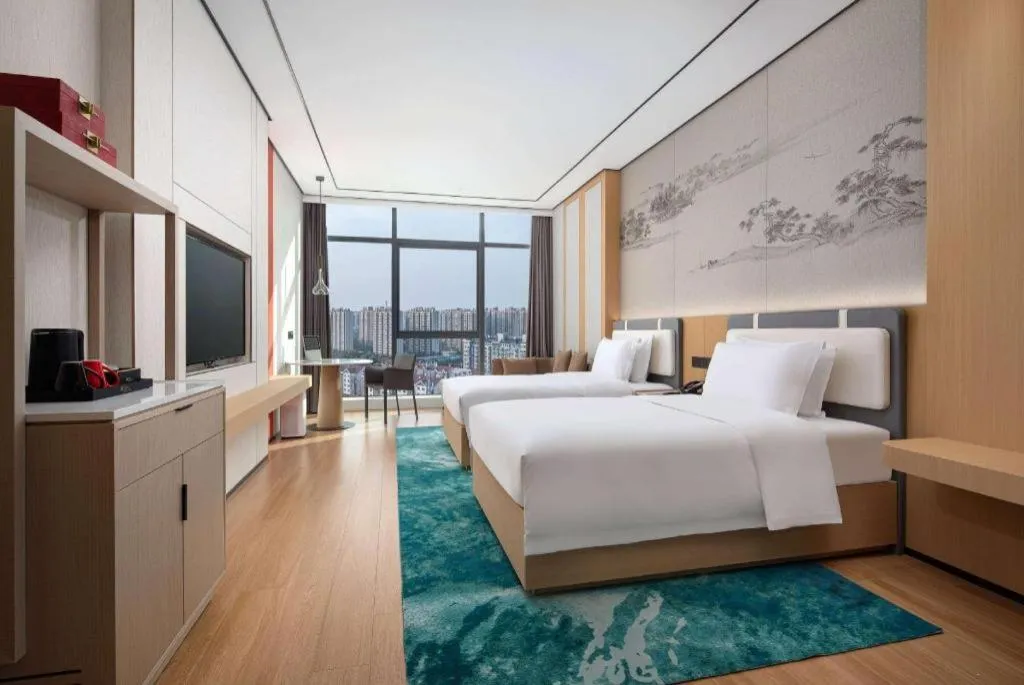 Bed in Ramada Encore by Wyndham Jinan Shanghe