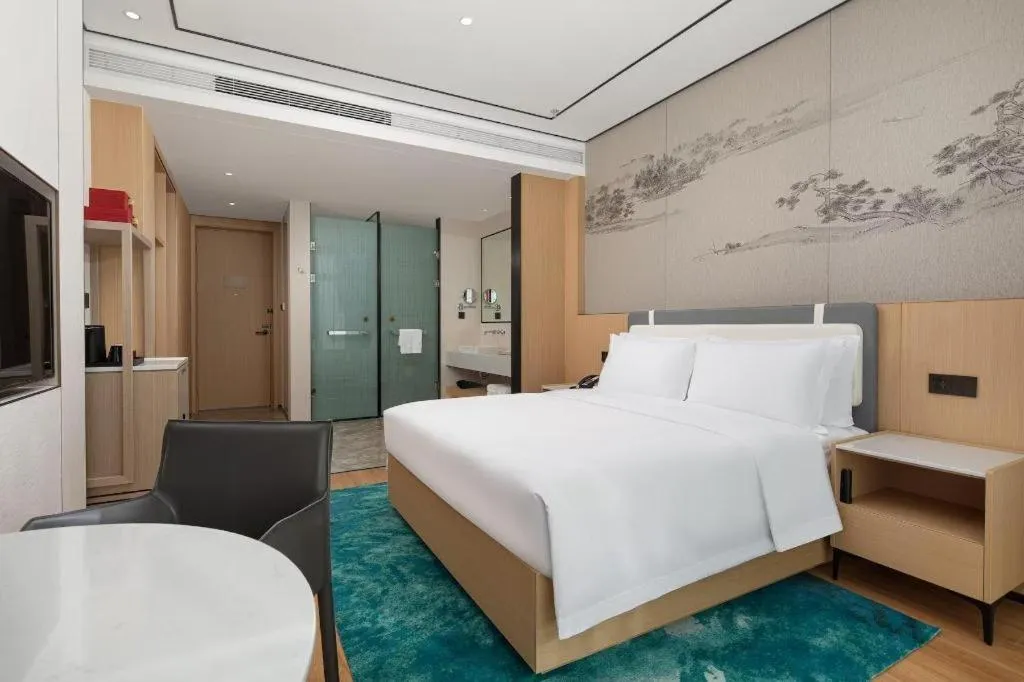 Bed in Ramada Encore by Wyndham Jinan Shanghe
