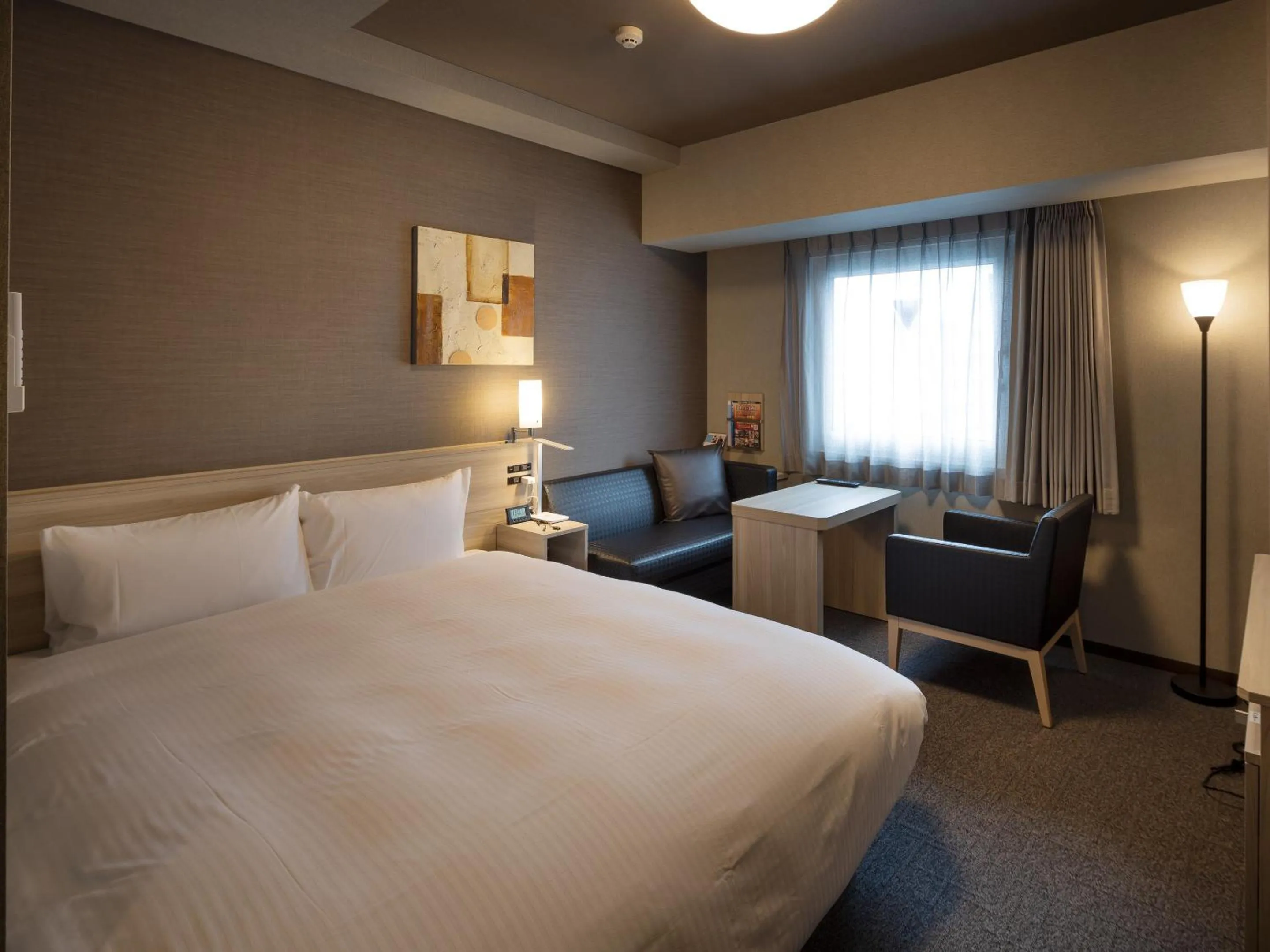 Photo of the whole room, Bed in Hotel Route Inn Grand Wakayama Eki Higashiguchi