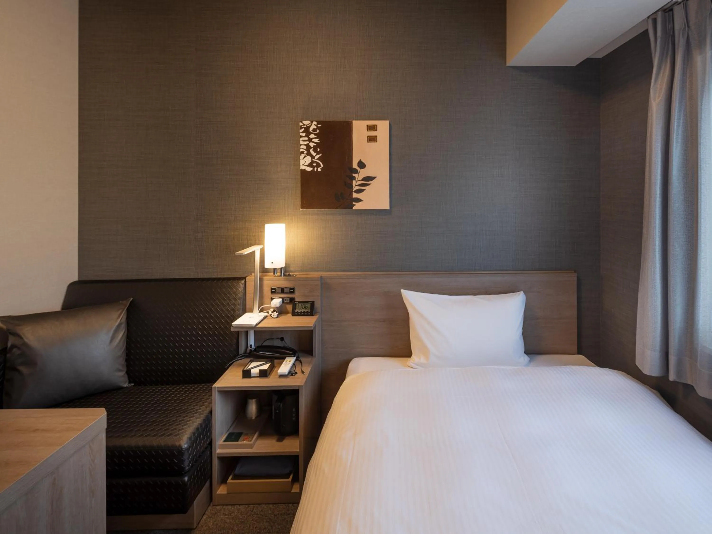 Photo of the whole room, Bed in Hotel Route Inn Grand Wakayama Eki Higashiguchi