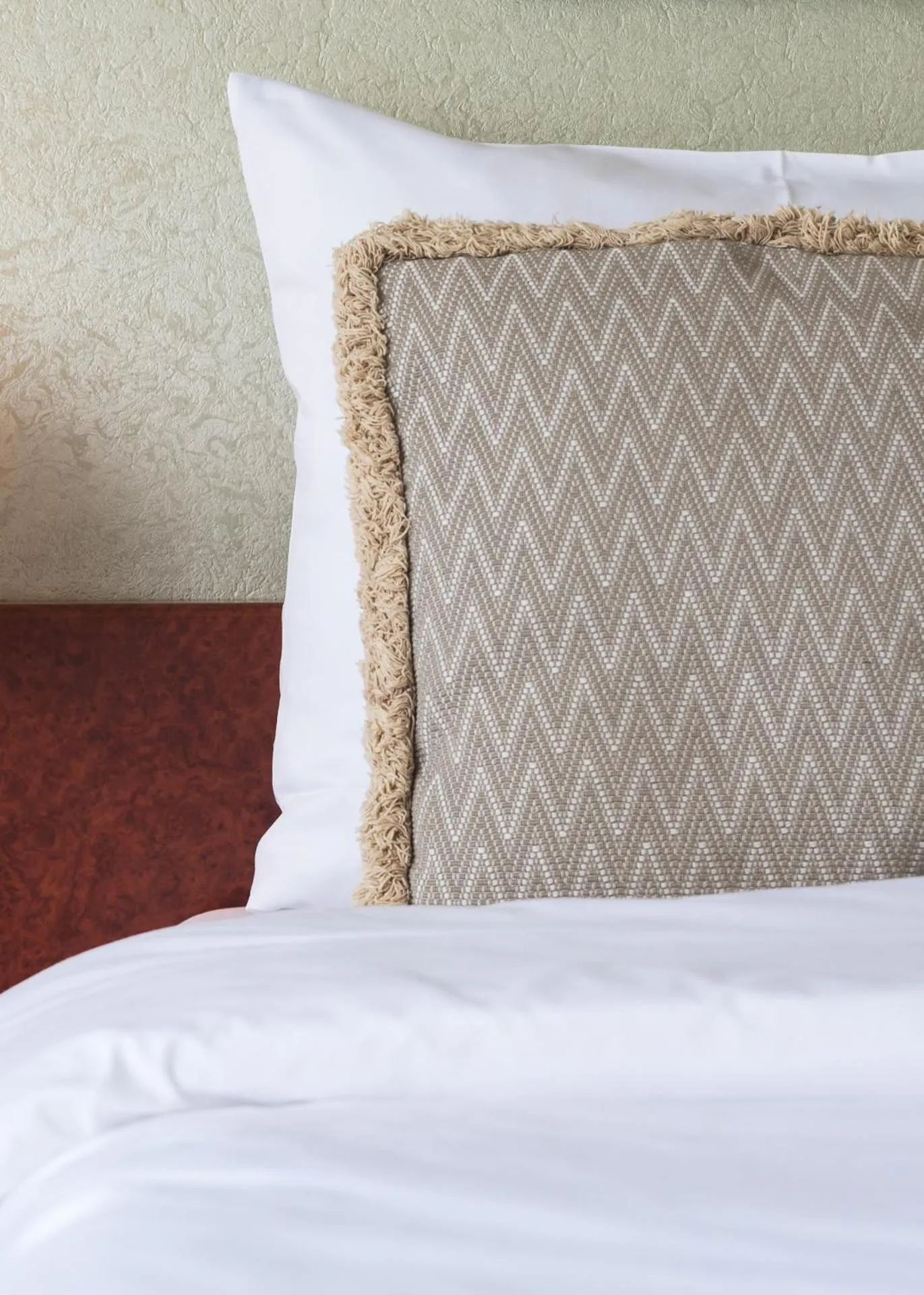 Bed in Prominent Inn Hotel