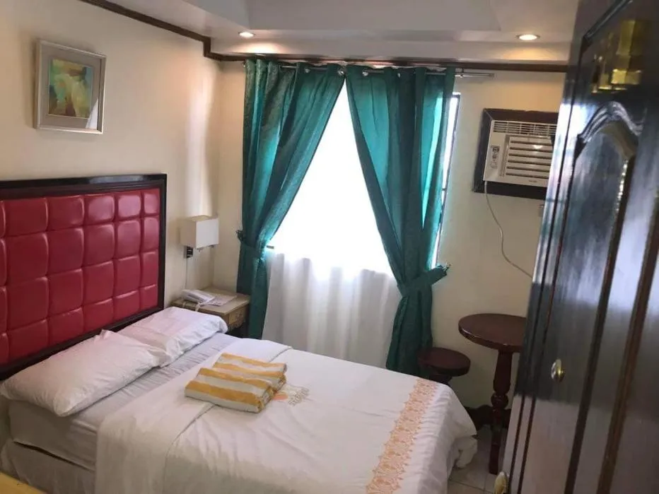 Bed in Sugarland Suites