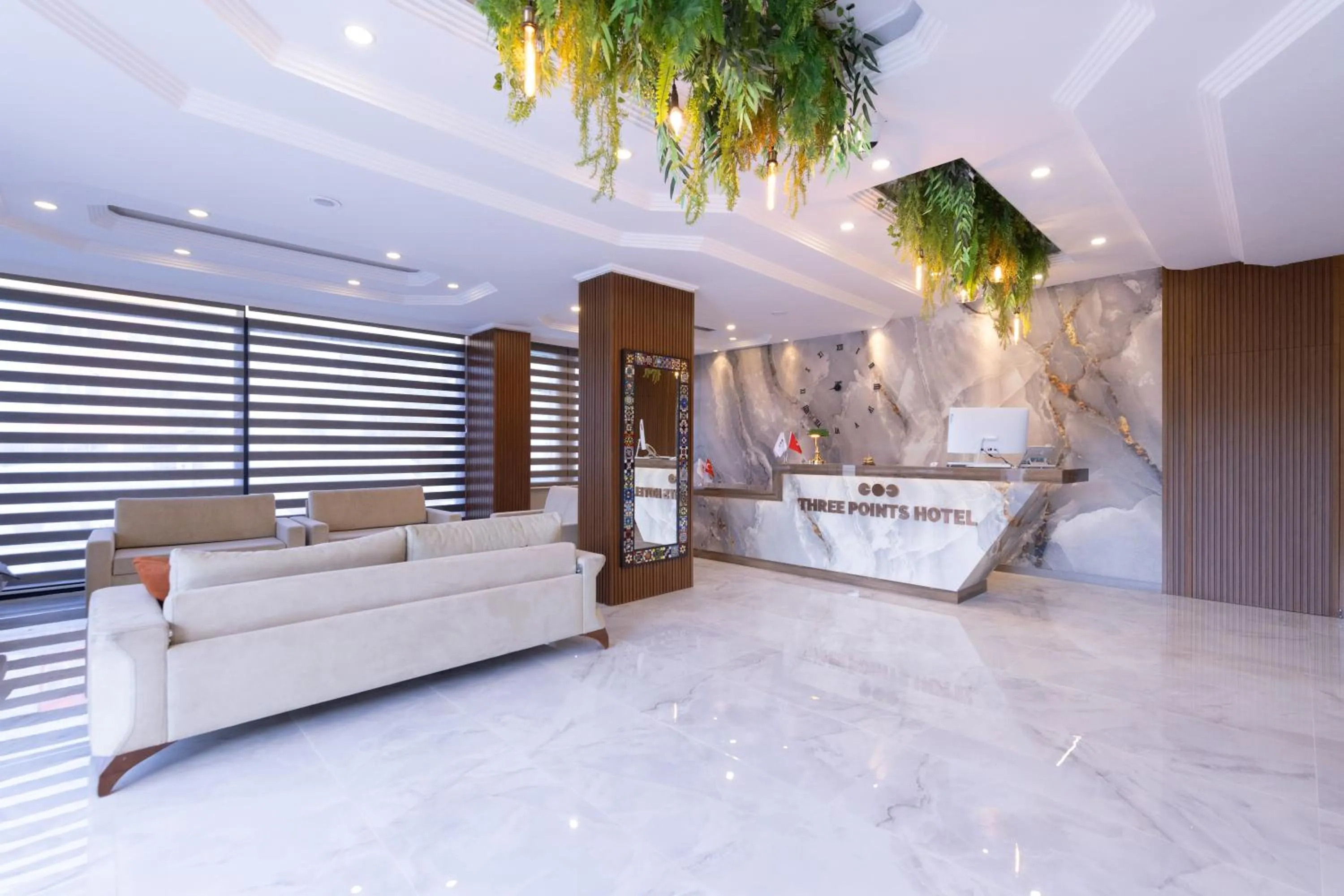 Lobby or reception in Three Points Hotel