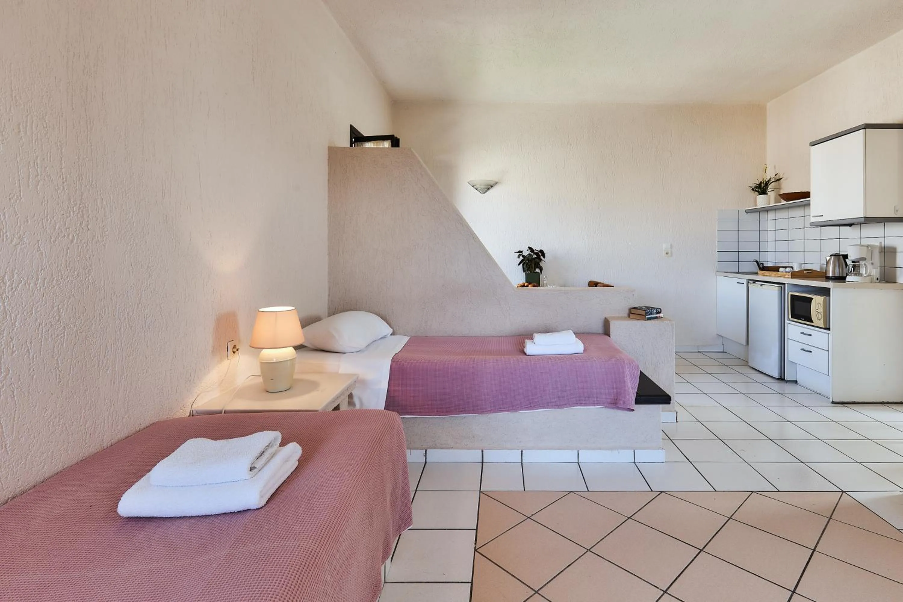 Bed in Creteco Hotel & Suites