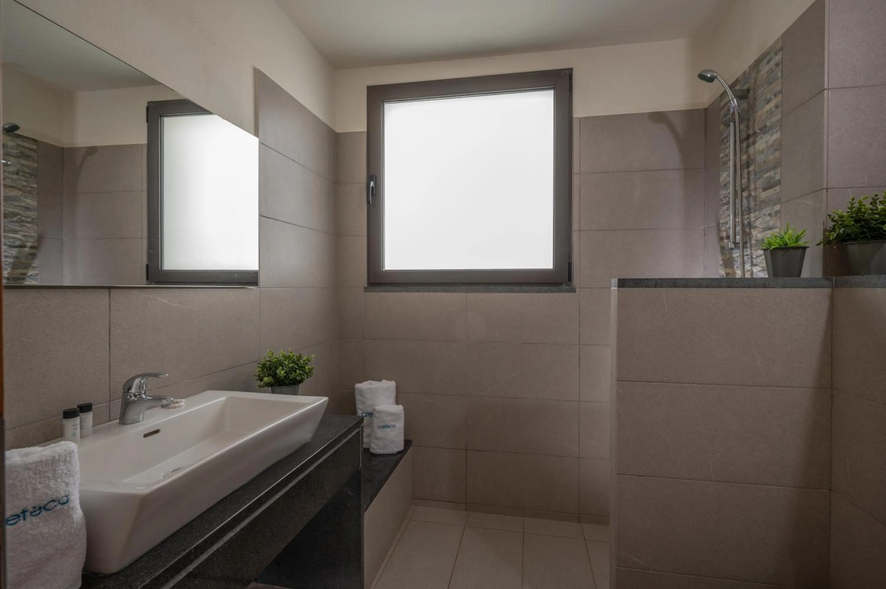 Bathroom in Creteco Hotel & Suites