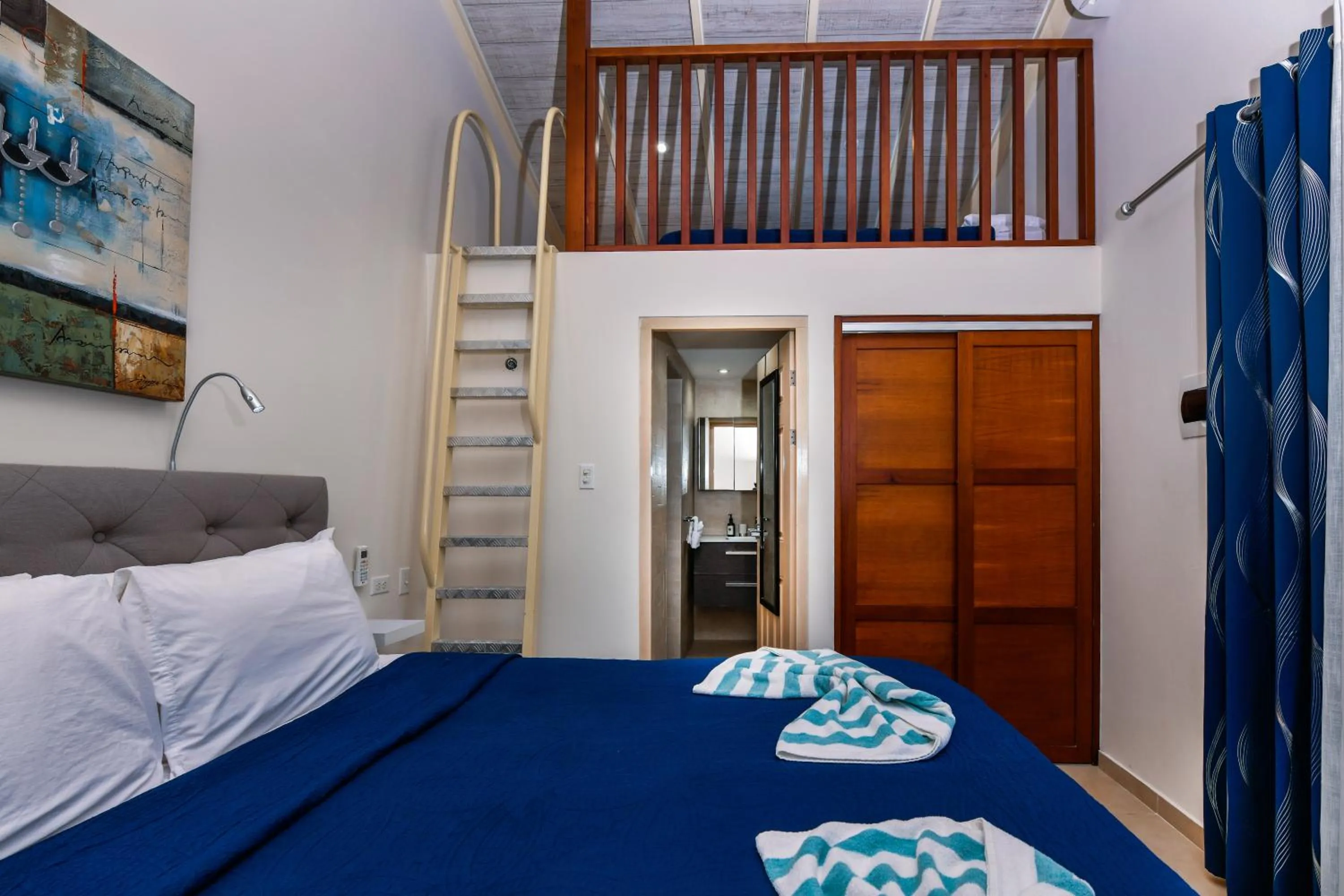 Bed in Boutique Hotel Swiss Paradise Aruba Villas and Suites