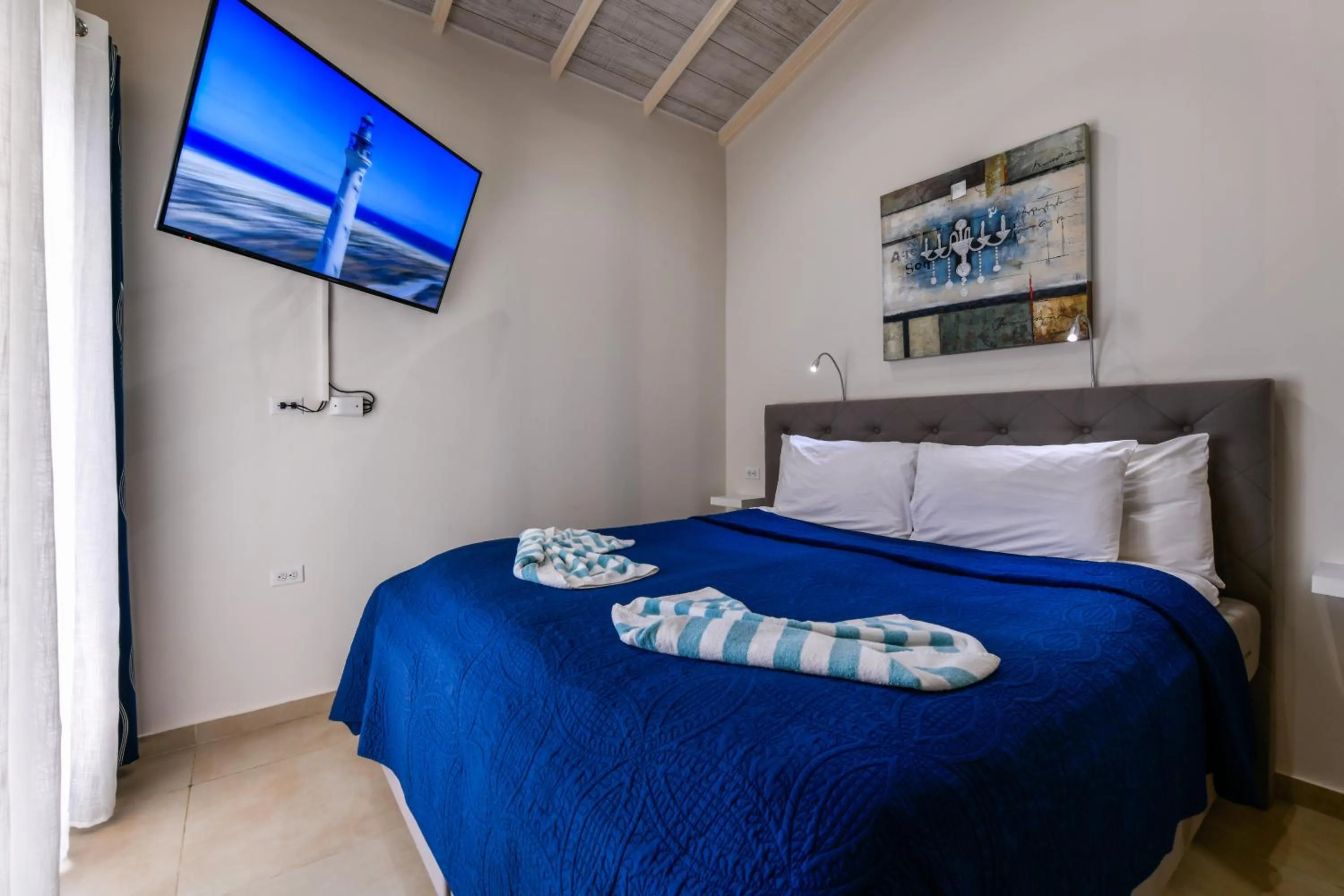 Bed in Boutique Hotel Swiss Paradise Aruba Villas and Suites