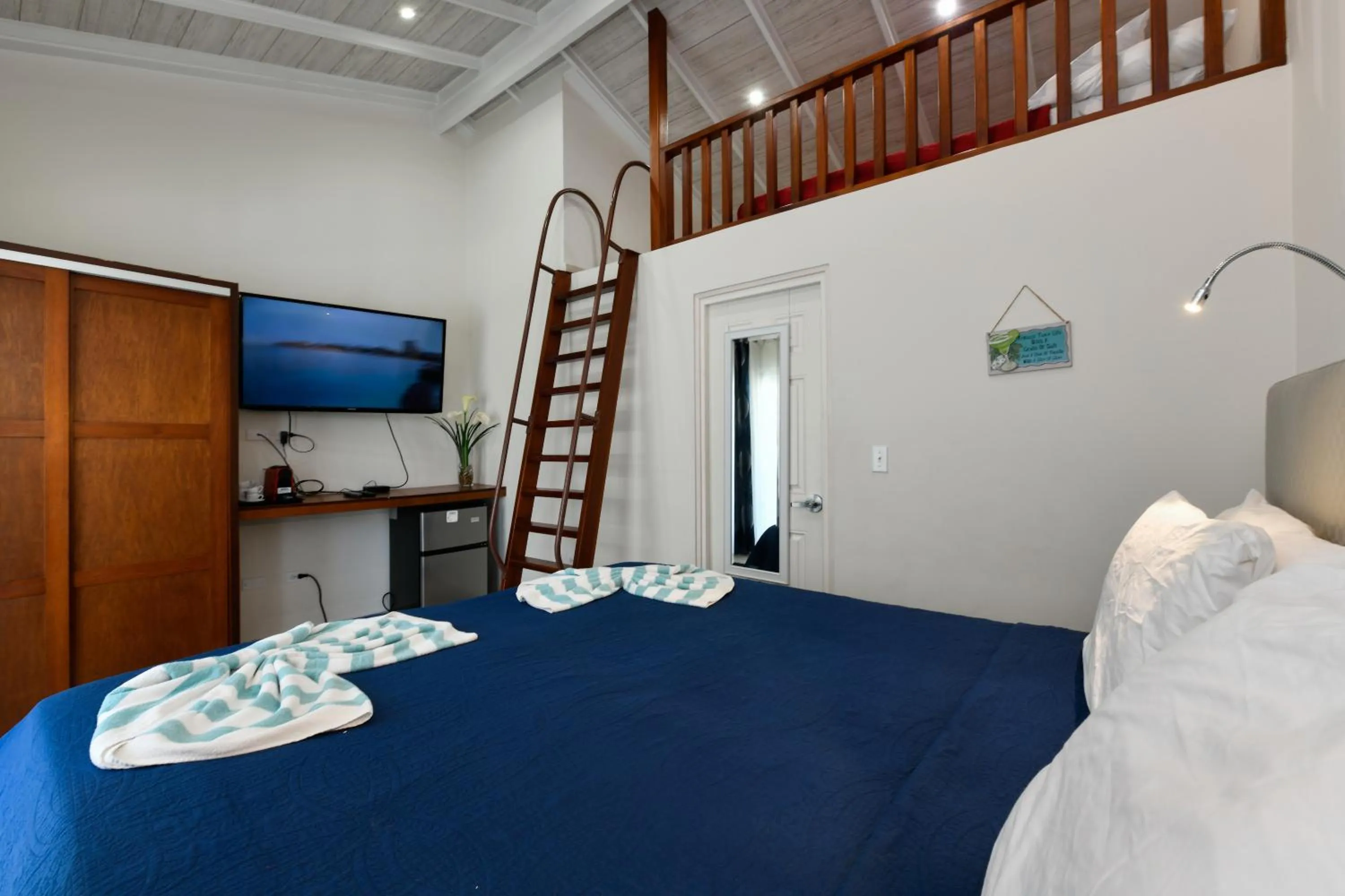 Bed in Boutique Hotel Swiss Paradise Aruba Villas and Suites