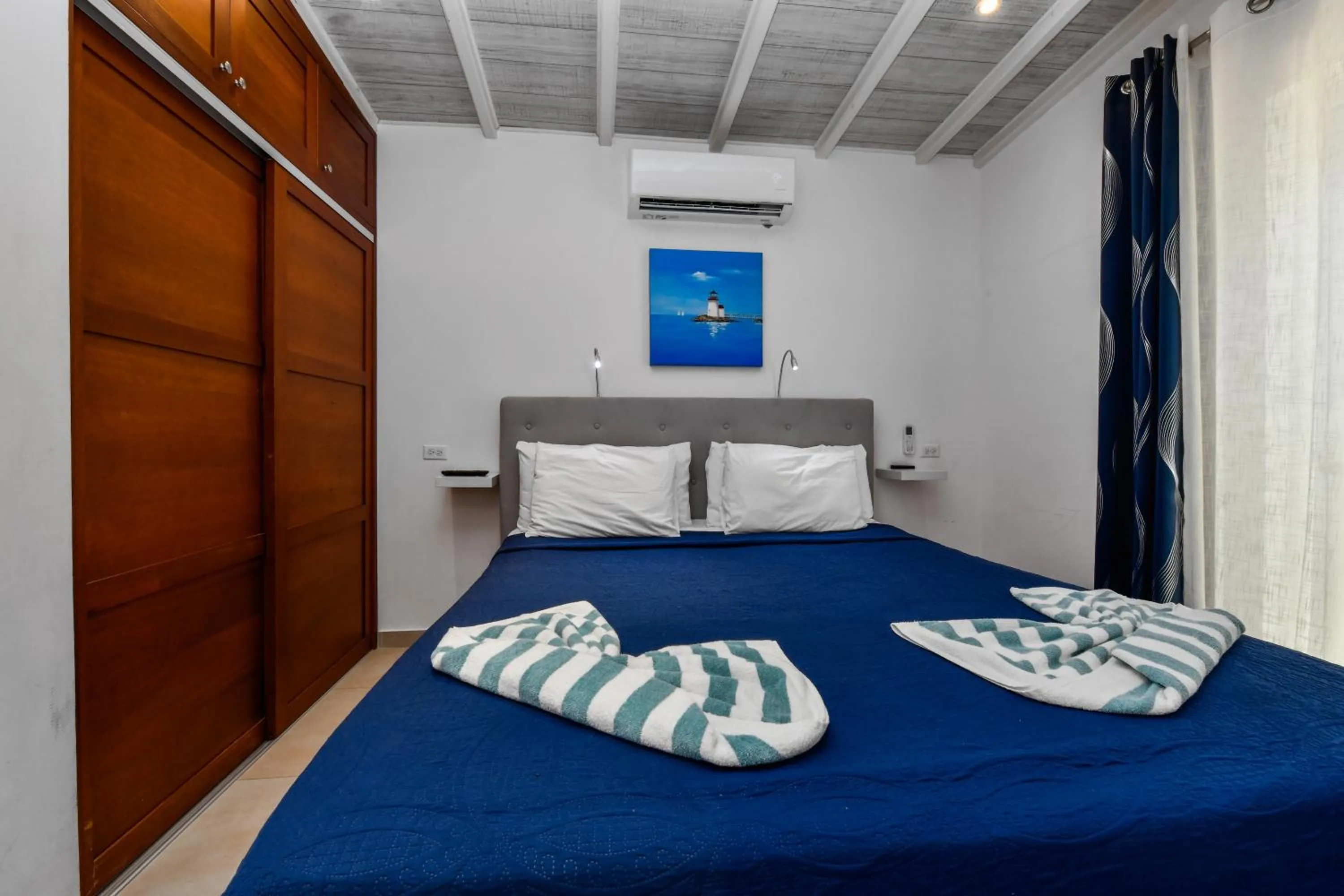 Bed in Boutique Hotel Swiss Paradise Aruba Villas and Suites