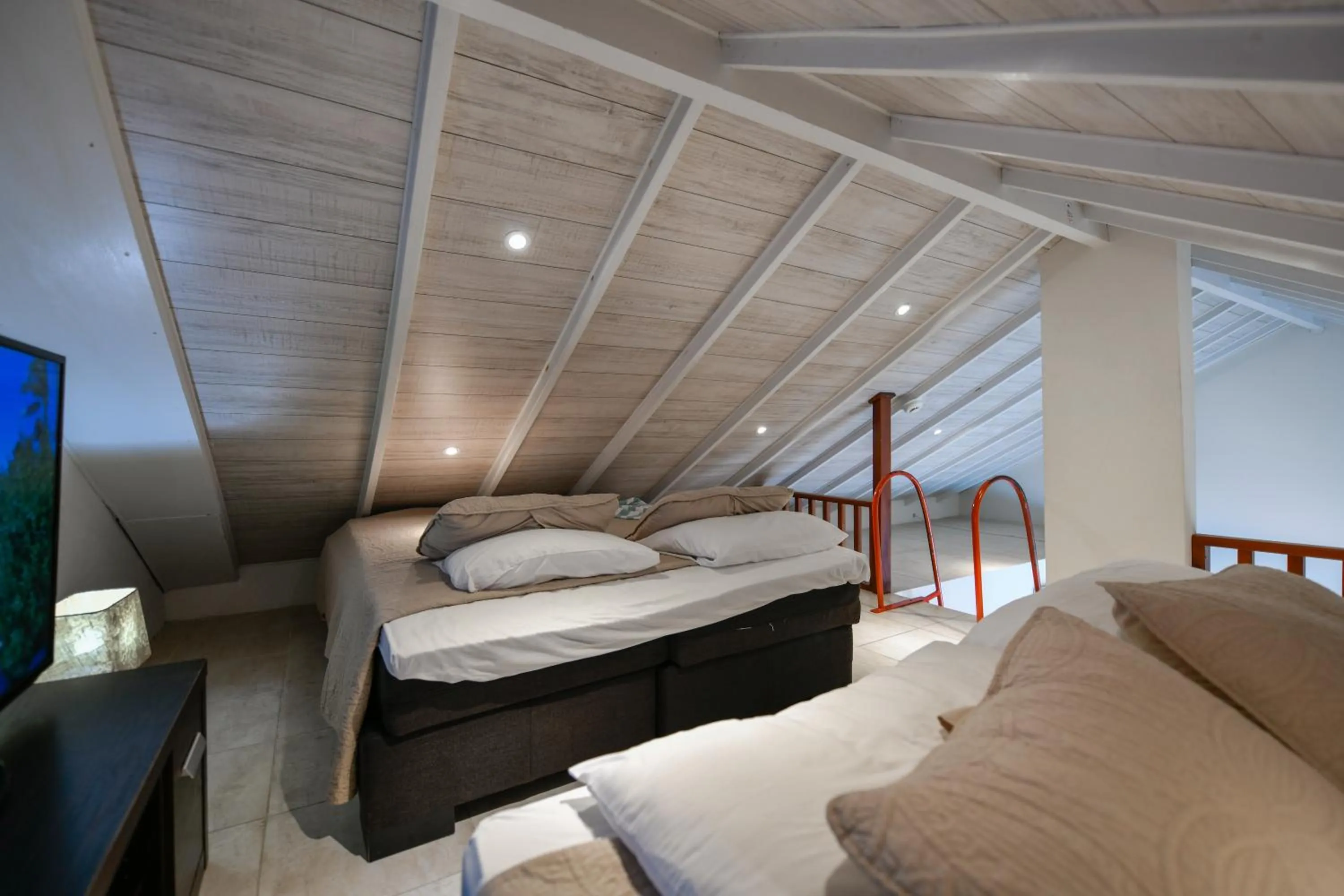 Bed in Boutique Hotel Swiss Paradise Aruba Villas and Suites