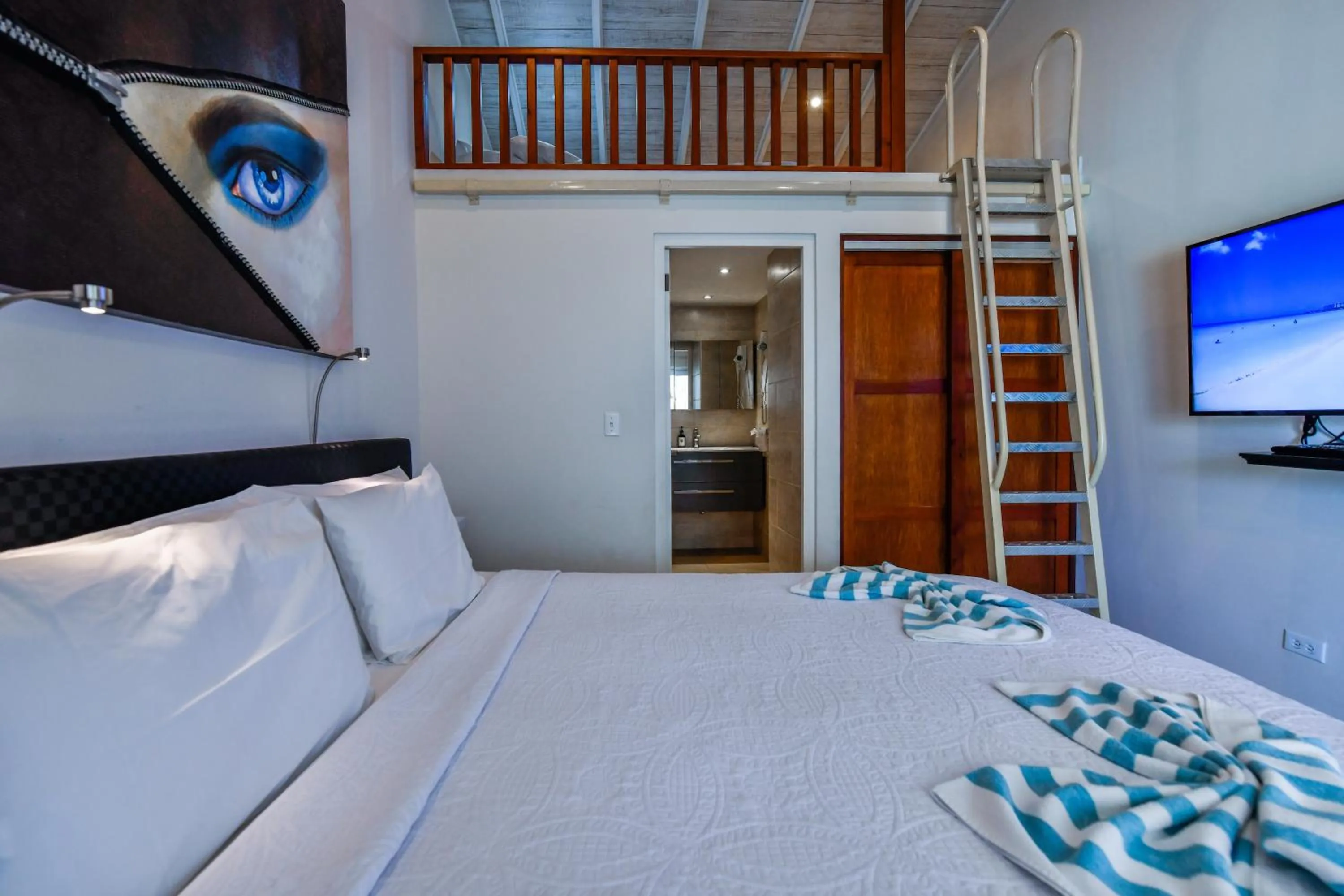 Bed in Boutique Hotel Swiss Paradise Aruba Villas and Suites