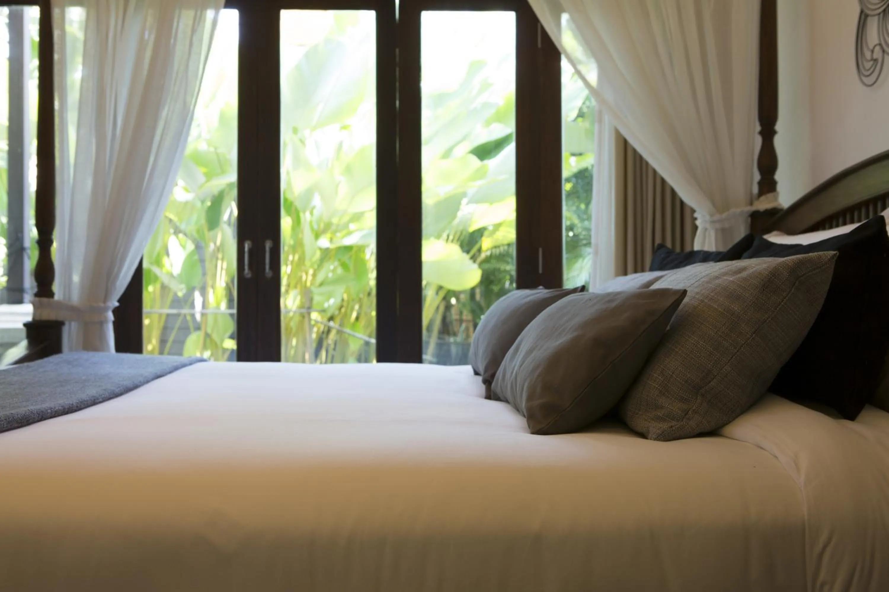 Bed in Tolani Southgate Villa Chiang Mai