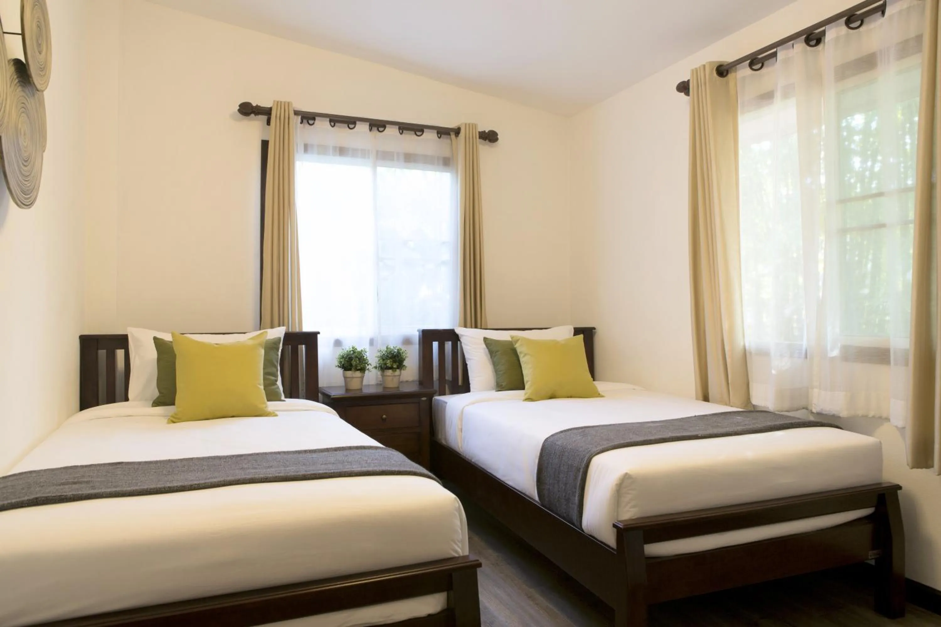 Bed in Tolani Southgate Villa Chiang Mai