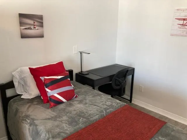 Bed in Sebastian Gardens Inn & Suites