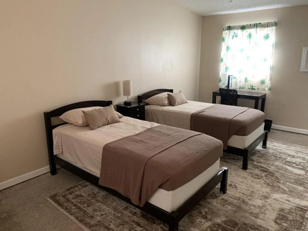 Bed in Sebastian Gardens Inn & Suites