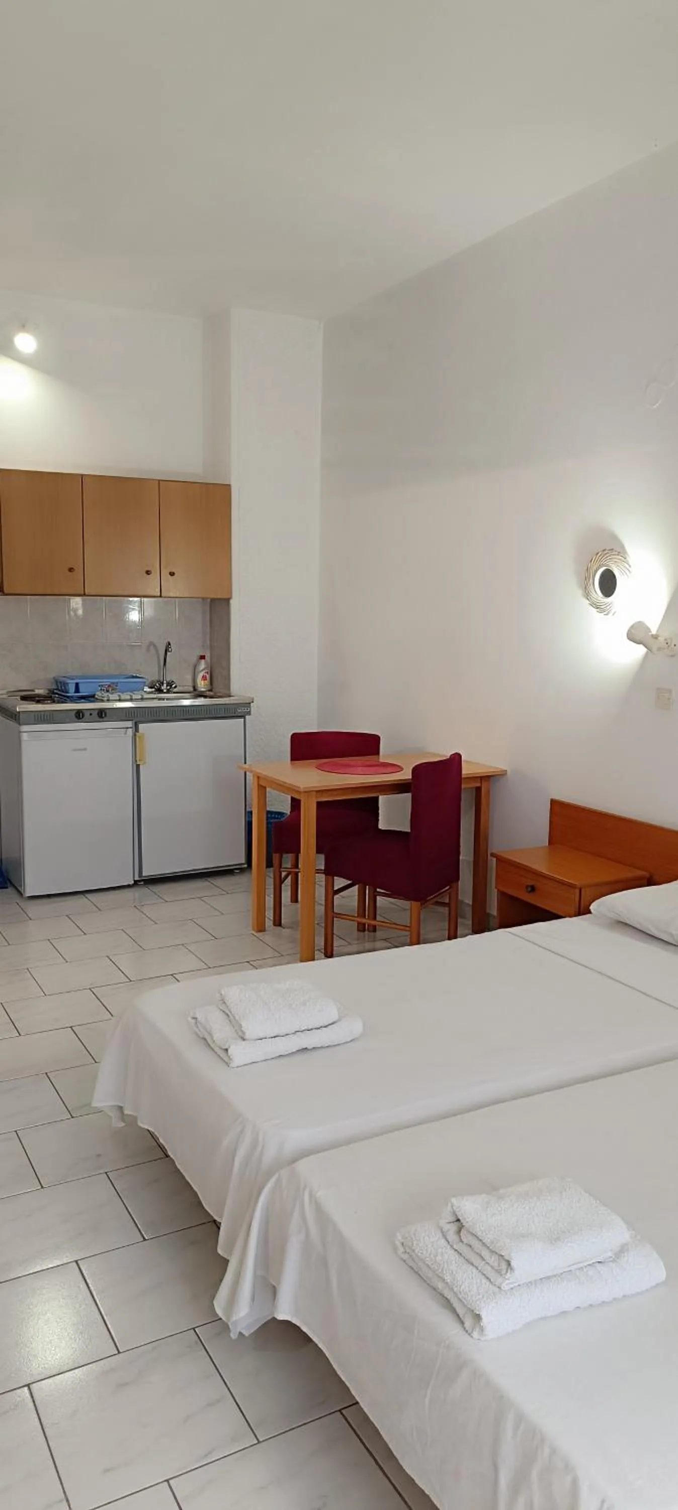 Bed in Pyrgos Hotel Apartments