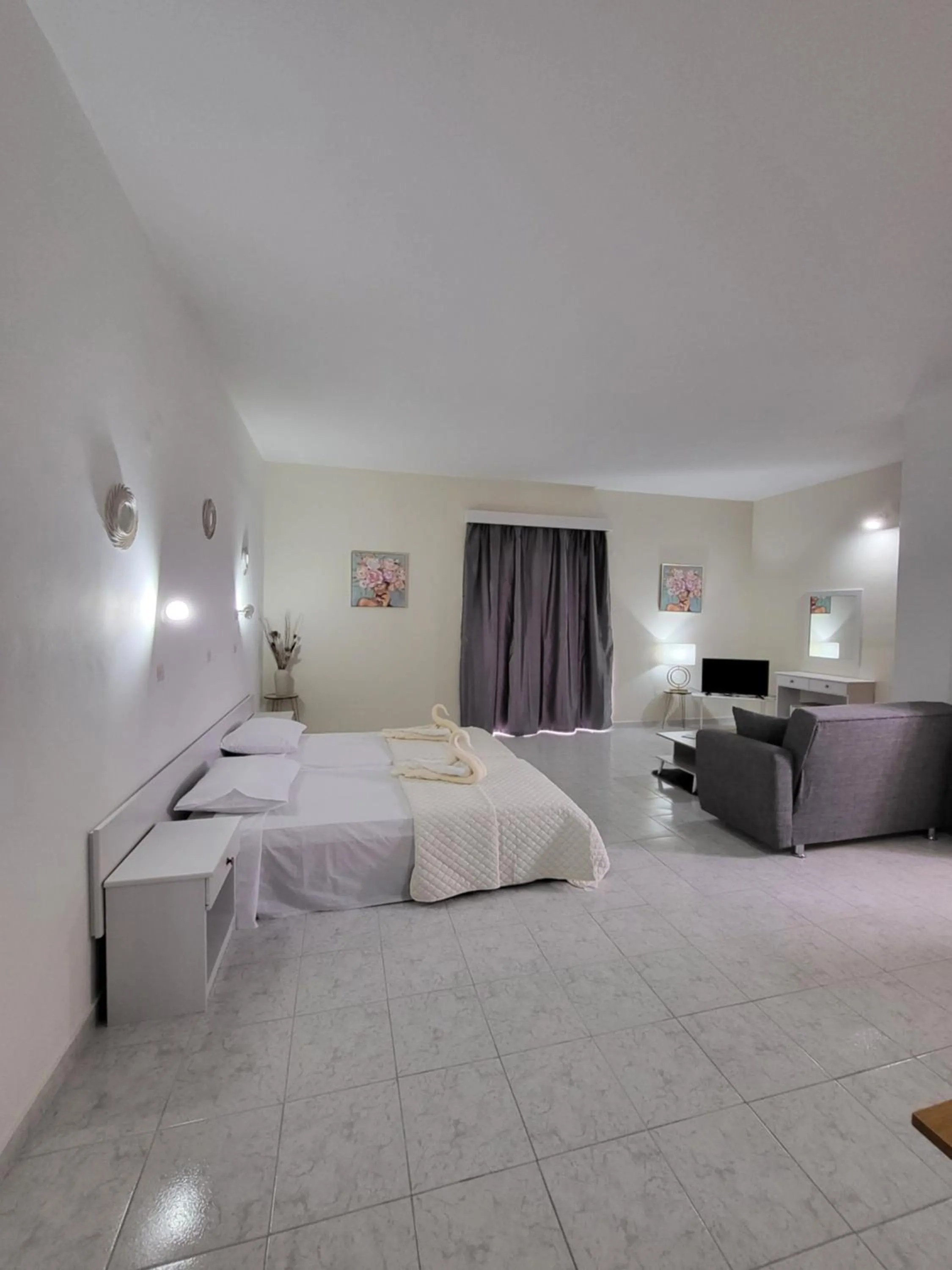 Bed in Pyrgos Hotel Apartments