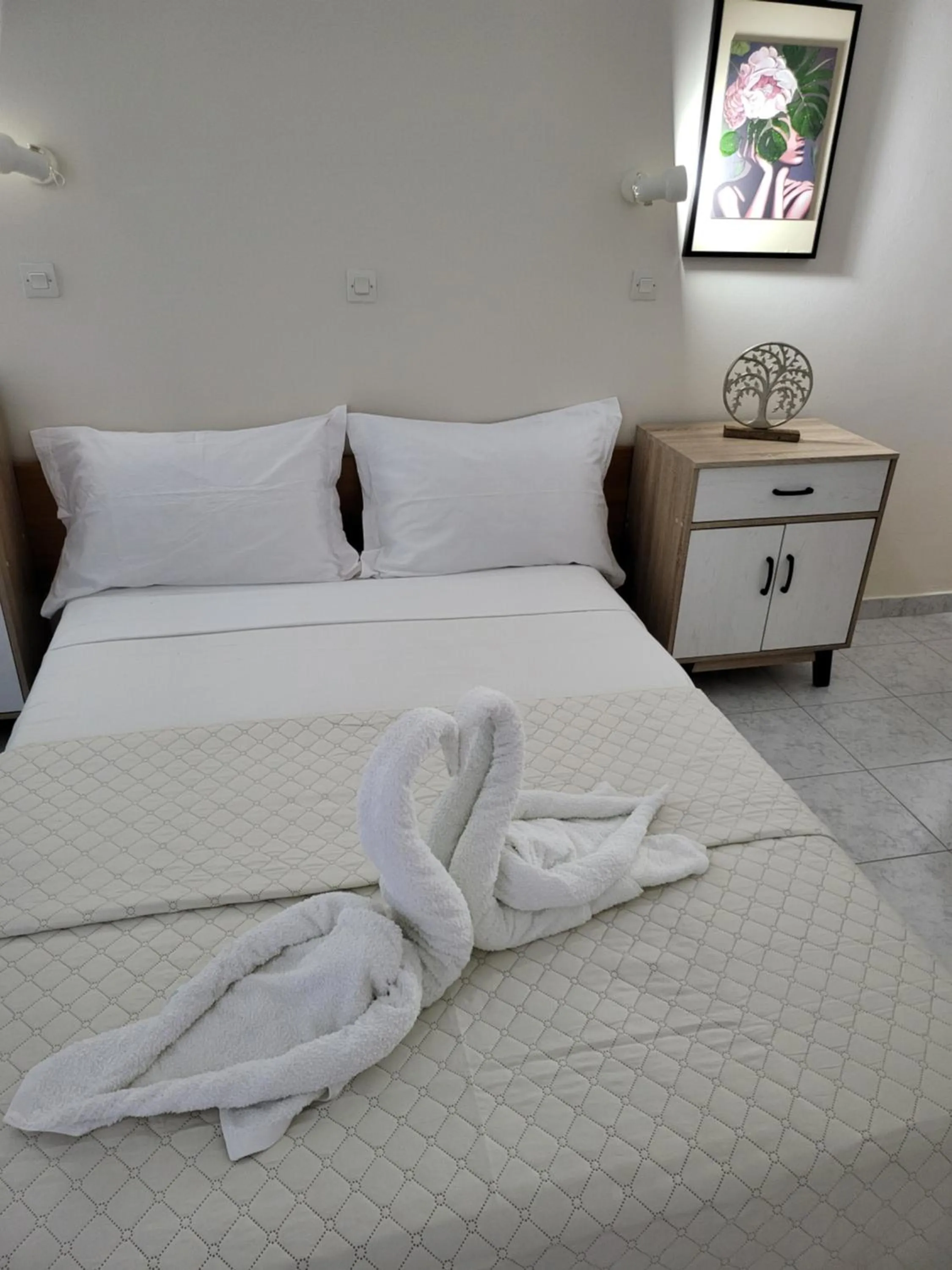 Bed in Pyrgos Hotel Apartments