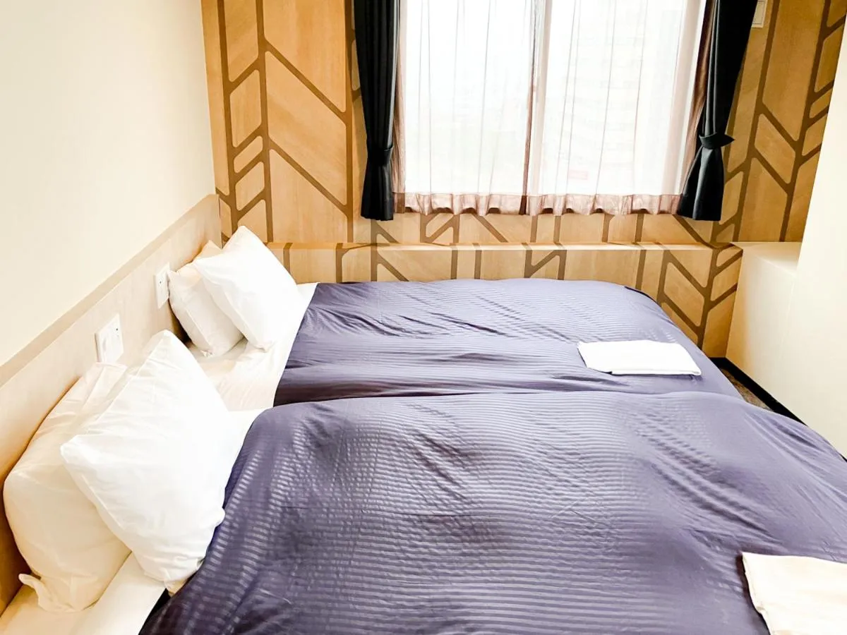 Bed in HOTEL LiVEMAX BUDGET Kobe
