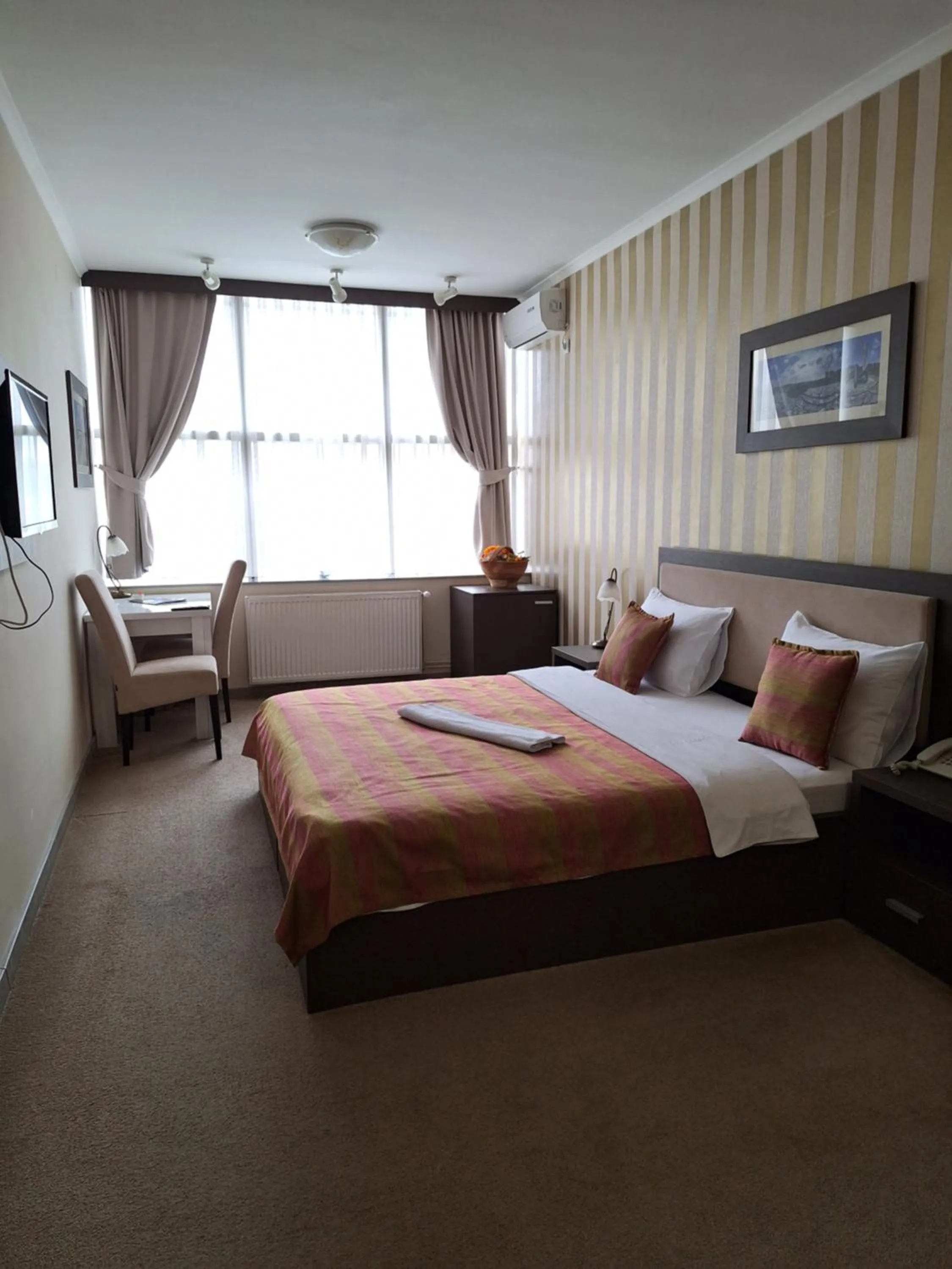 Bed in Garni Hotel Ema