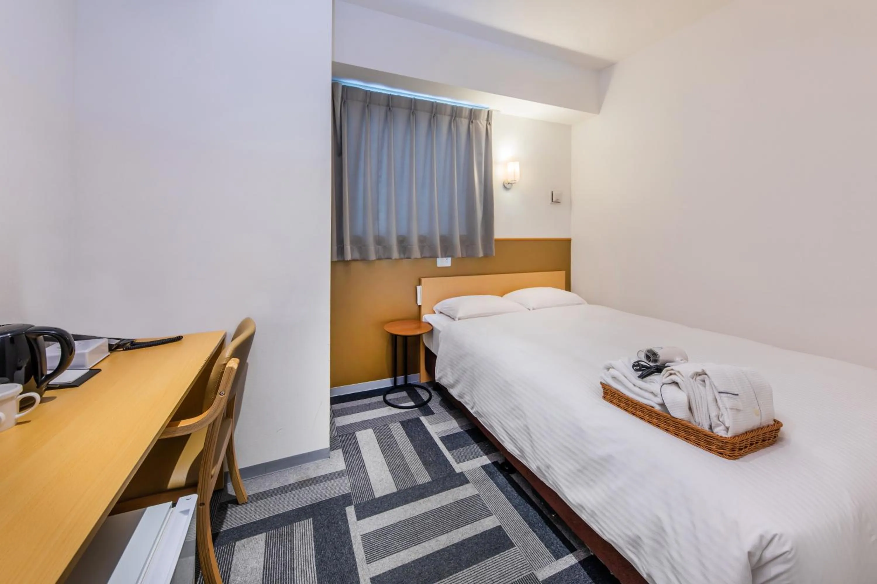 Bed in HOTEL NEXUS Hakata Sanno